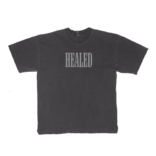 Vintage Black t-shirt that says "HEALED" across the front in light grey ink.
